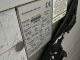 a close up of a washing machine with a label on it