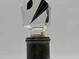 an image of a glass bottle with a black and white design on it