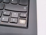 a close up of a black keyboard on a white surface