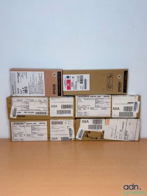 a stack of boxes on top of a wooden table