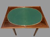 an image of a table with a green top and a wooden base