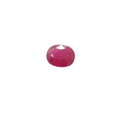 an oval ruby stone with a white background