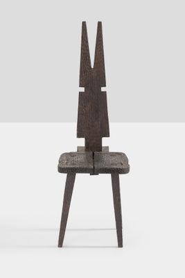 the chair is made of wood and has two legs