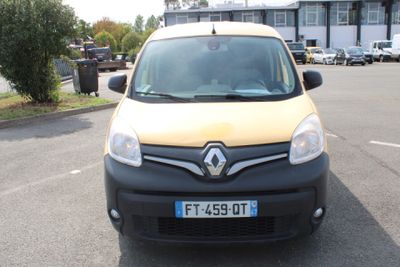 a small black and yellow van parked in a parking lot