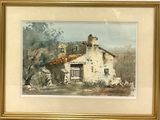 tableau représentant une maison blanche au toit marron, dans un cadre doré