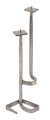 a metal stand with two pieces of metal on it