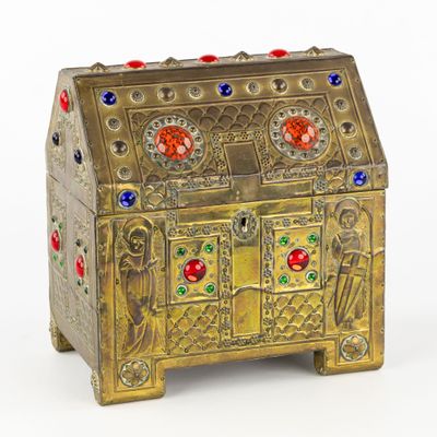 an image of a gold chest with colorful stones on it