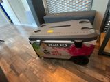 a cooler that is sitting on the floor in the room