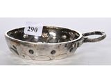 a silver plated bowl with a handle and handles