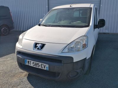 a small white van parked in front of a building