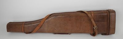 an old leather gun case on a white background