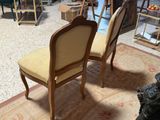 two chairs that are sitting in the middle of a room