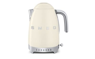 an image of a cream colored kettle with the word smeg on it
