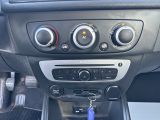 a close up of a car ' s dashboard with a key in it