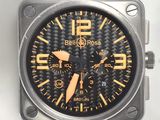 bell & ross watch with black rubber strap and gold accents