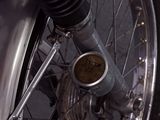 a close up view of a motorcycle tire with a chain attached to it