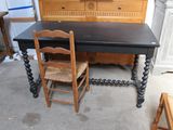 a table with two chairs and a dresser in a room