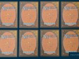 six decks of magic the gathering cards are arranged in a row