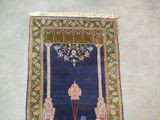 a blue rug with a picture of a man and a woman on it