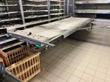 a kitchen with a lot of shelves and baskets on the floor