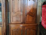 two armoires and a cabinet in a room