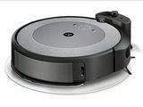 an image of a robotic vacuum cleaner on a white surface