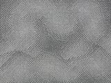 a gray rug with a pattern on the bottom of it