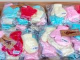 many pairs of socks in a box on a table