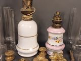 several different types of glass and brass items on a table