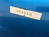 the back end of a blue car with a sticker that says vauto