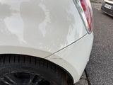 a white car parked on the side of the street