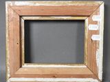 an old picture frame with some paint on it sitting on a table