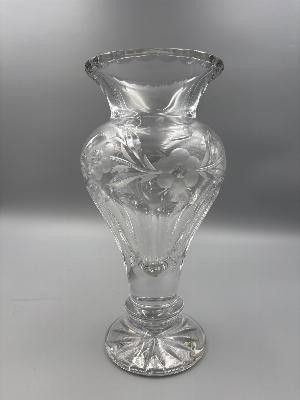 a glass vase that is sitting on a table