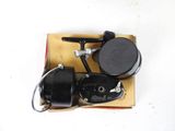 a black and silver fishing reel and a black and white reel