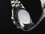 a close up of a watch on a metal bracelet