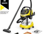un aspirateur jaune et noir à côté d'une éponge de nettoyage