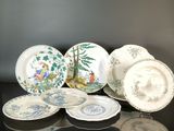 many plates that are sitting on a table