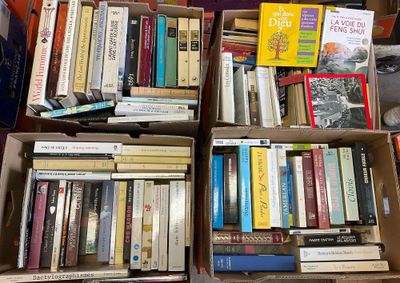 boxes of books are stacked on top of each other in a room