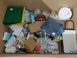 a cardboard box filled with assorted items in it