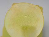 a close up of a piece of fruit on a white surface
