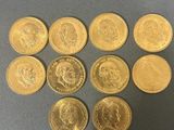 a bunch of gold coins sitting on top of a table