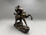 an image of a bronze statue of a man on a horse