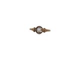 a close up of a ring with a pearl in it on a white background