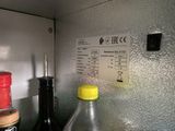 a bottle and a bottle of liquid on a counter