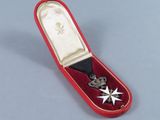 a red case with a star and a cross in it