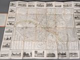 an old map of the city of london on display on a table