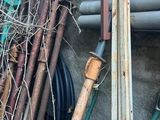 a pile of pipes and pipes next to a building