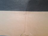 an open cardboard box with a black and white stripe on it