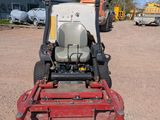 an image of a lawn mower parked in a parking lot