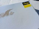 a cardboard box with a sticker on it sitting on a table